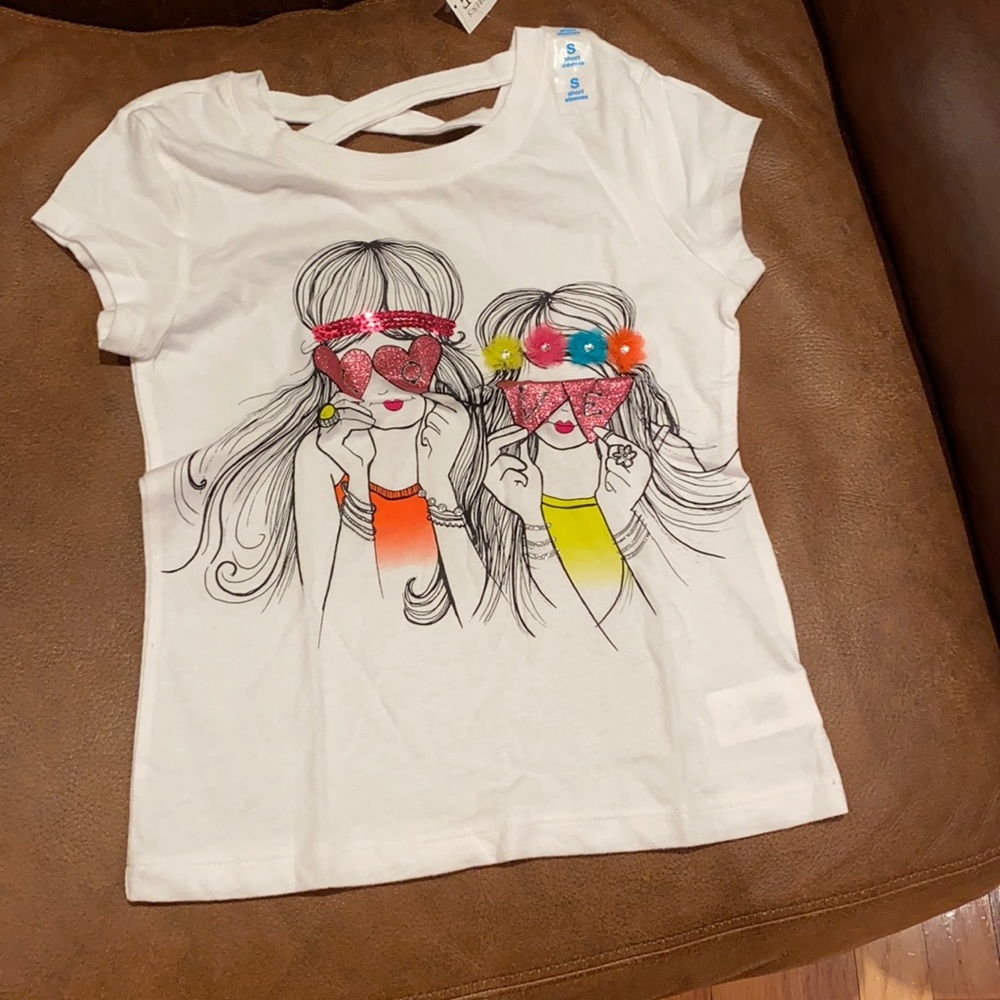 Shirt with white background.  Size small (5/6)